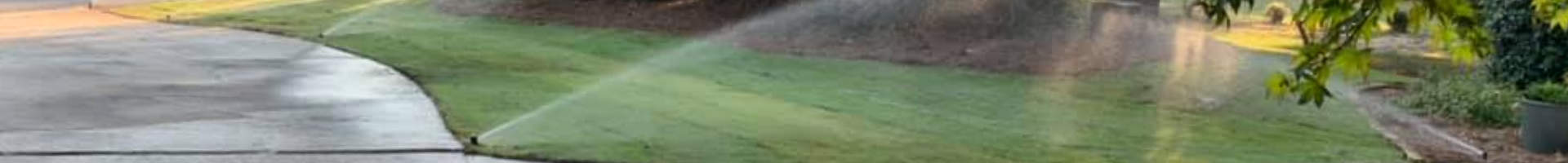 sprinklers watering lawn
